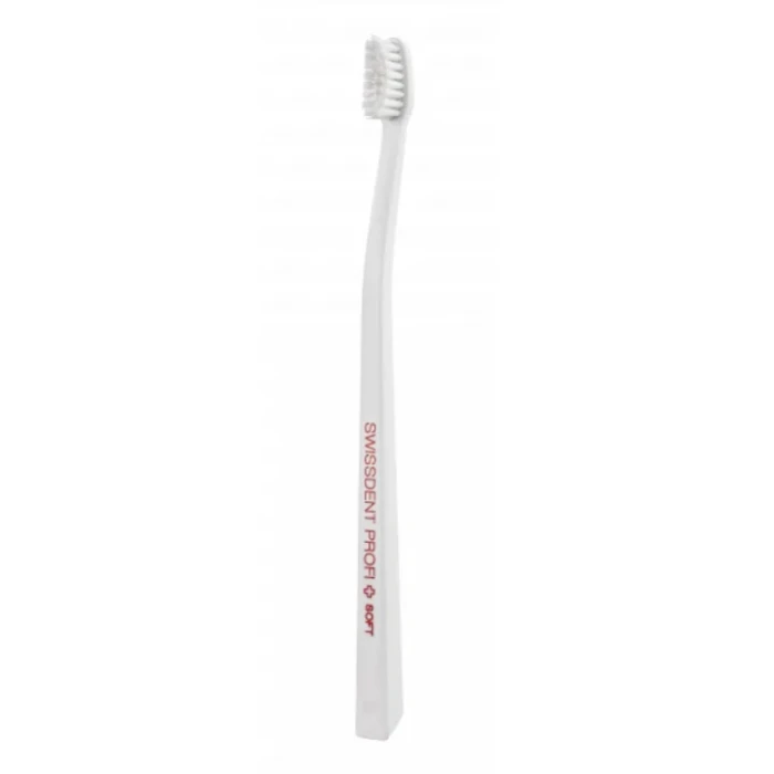 Szczoteczka do zębów SWISSDENT Profi Gentle Extra Soft w oryginalnym przezroczystym opakowaniu, ultramiękkie włosie i smukła biała rękojeść, widok produktu z przodu.