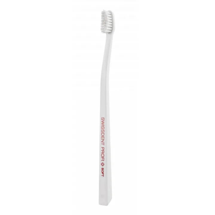 Szczoteczka do zębów SWISSDENT Profi Gentle Extra Soft w oryginalnym przezroczystym opakowaniu, ultramiękkie włosie i smukła biała rękojeść, widok produktu z przodu.